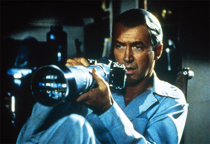 James Stewart holding a camera in Rear Window