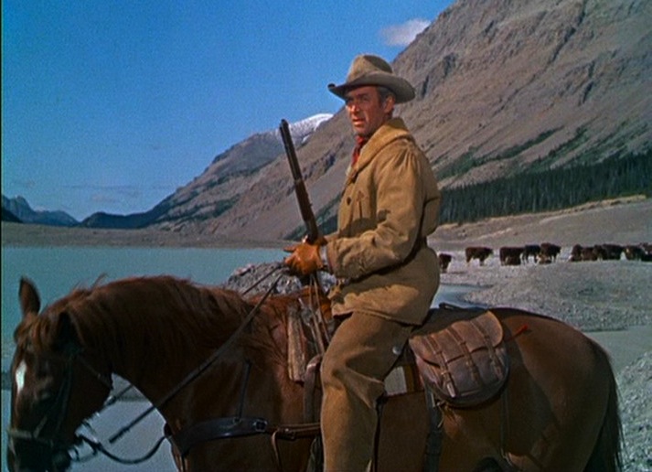 Jimmy Stewart riding a horse during his western-film era